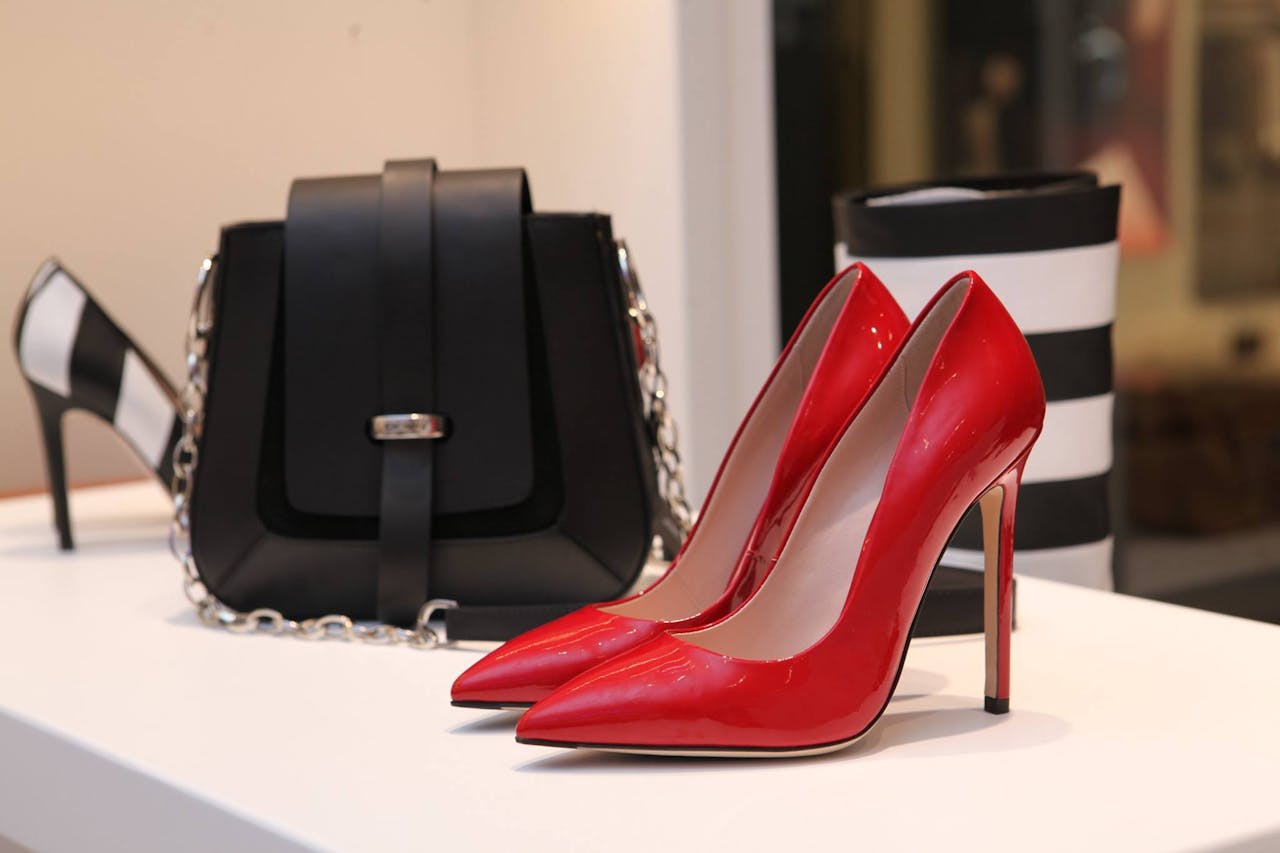 Crafting Captivating Headlines: Your awesome post title goes here Showcasing sleek red stilettos and a chic black handbag in a luxury boutique setting.