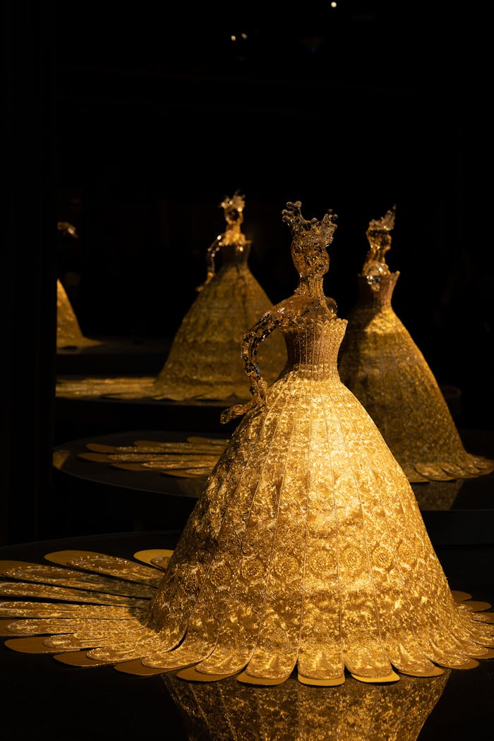 The Art of Drawing Readers In: Your attractive post title goes here A beautifully lit golden figurine in a dark setting, with multiple reflections enhancing elegance.